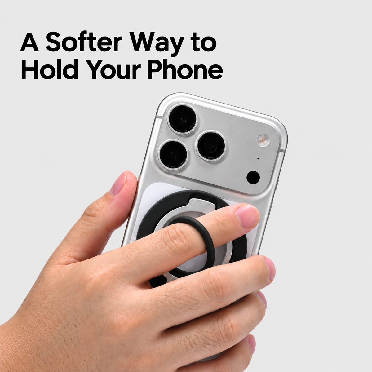 Hand holding a phone using the soft silicone ring grip.